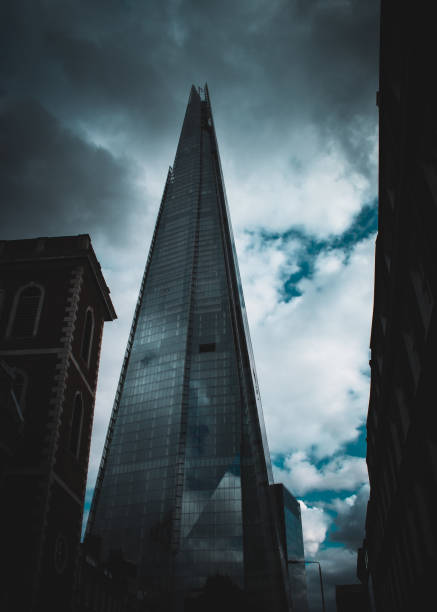 istock Low angle view of buildings against cloudy sky 1448652297