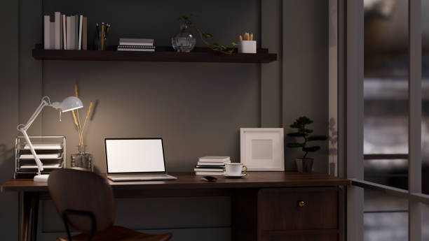 istock Modern dark office working space at night with laptop mockup, office supplies and decor on table 1448653546