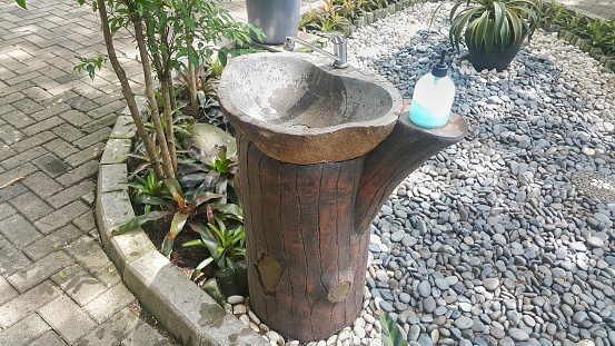 Natural stone sink in the garden outdoor