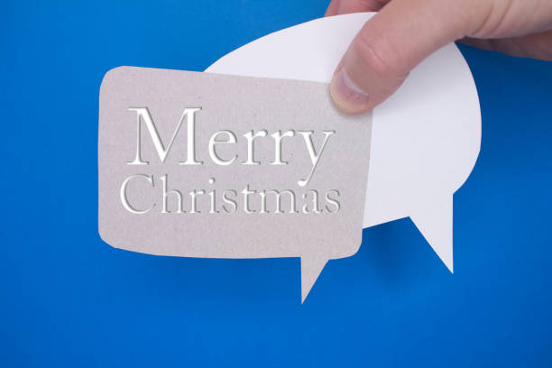 istock Speech bubble in front of colored background with Merry Christmas text. 1448659535