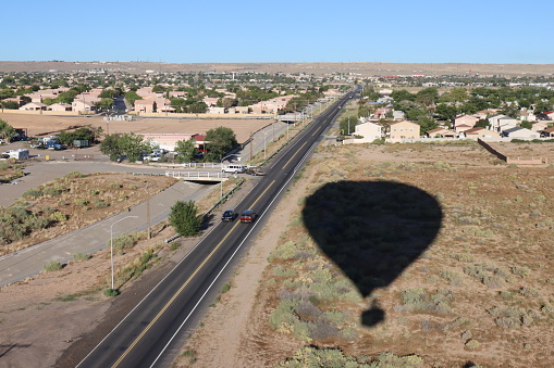 A self-portrait of the shadow from a hot air balloon over Albuquerque