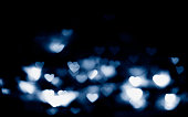 Blue heart blurred glitter background.