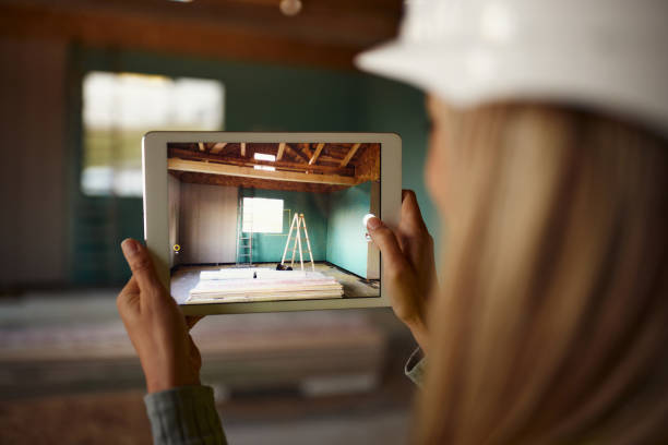 istock Close up of civil engineer using touchpad at construction site. 1448678422