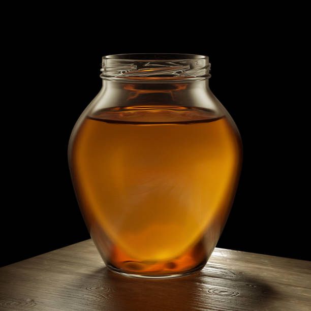 Honey on a black background without a lid.