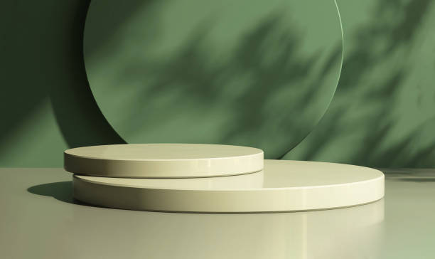 istock Two layer green round glossy podium with dappled sunlight, leaf shadow on matte dark green abstract wall with space in background 1448679416