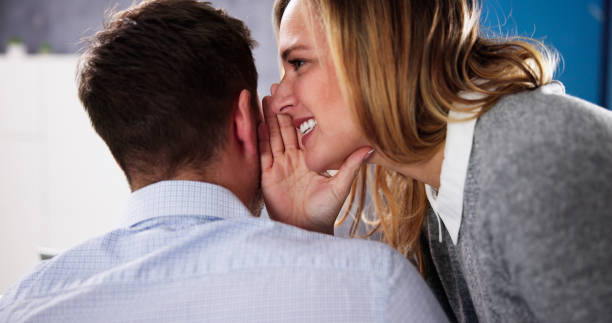istock Whispering In Business Man's Ear 1448681763