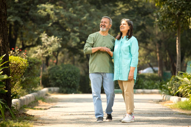 istock Happy senior couple spending leisure time in park 1448681943