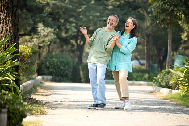 istock Happy senior couple spending leisure time in park 1448681993