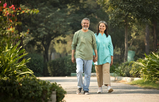 istock Happy senior couple spending leisure time in park 1448682040