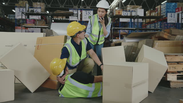 Male worker falling down in warehouse