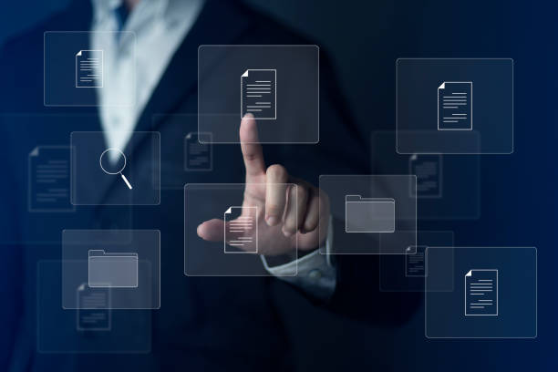 istock Document Management System DMS and Software for archiving searching and managing files online document database. Consultant information technology setup DMS working on computer 1448684525