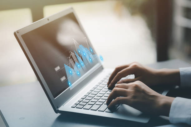 istock A businessman examines data on financial documents, company financial reports, graphics showing financial and numerical growth data. The concept of financial management to grow and be profitable. 1448685289