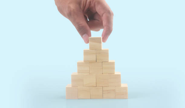 istock Wooden cubes in hand with copy space for input wording 1448687513