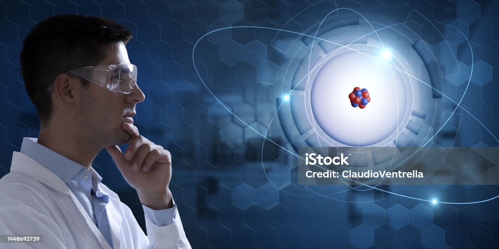 Scientist Studying Atomic Model Stock Photo - Download Image Now ...