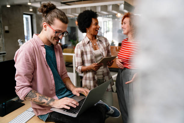 istock Team of young creative marketing experts brainstorming during work 1448695328