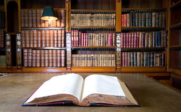 Open book in old library. Part of series stock photo