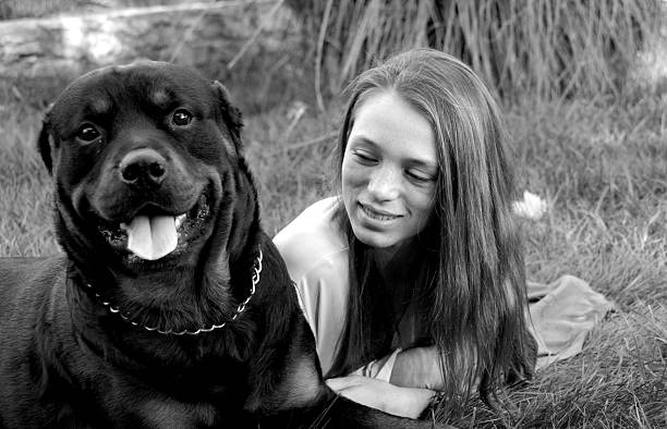 istock girl and rottweiler 144870124