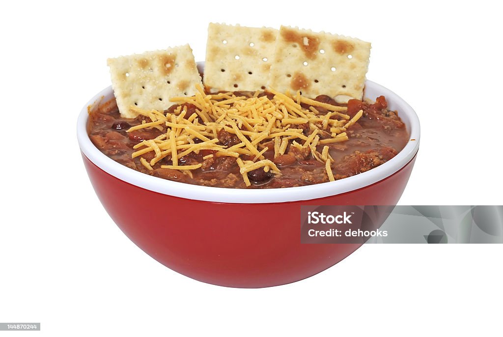 Chili with Cheese, Beans, and Crackers Bowl of hot chili with beans, cheese, and crackers.  Isolated on white background with clipping path. Chili Con Carne Stock Photo