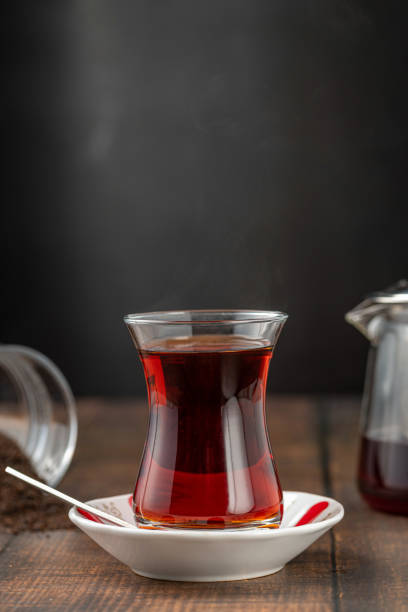 istock Freshly brewed turkish tea in front of dark background 1448705023