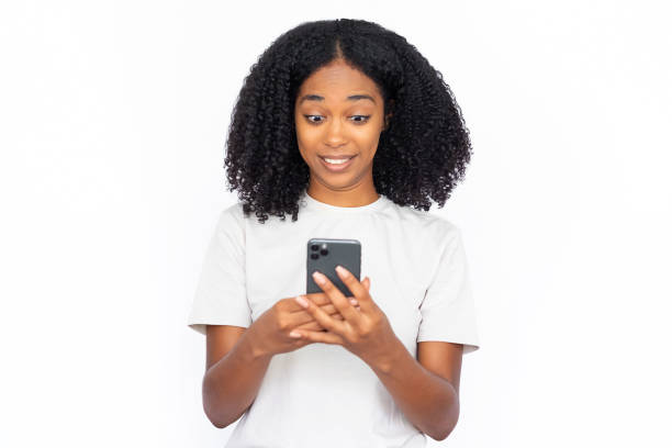 istock Amazed African American woman using phone 1448705571