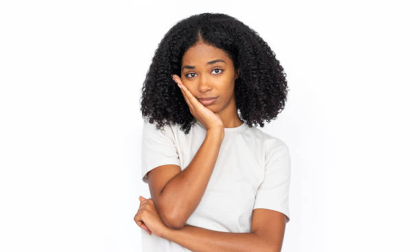 istock Bored multiracial woman leaning on hand 1448705574