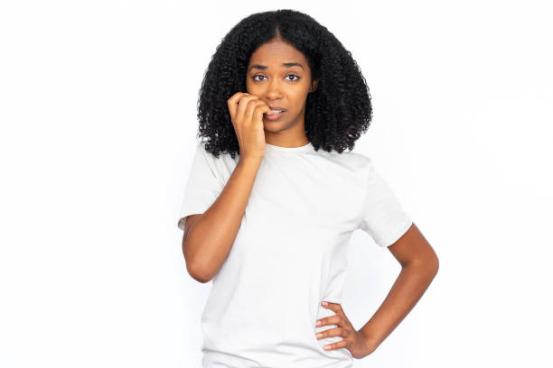 istock Nervous multiracial woman biting nail 1448705653