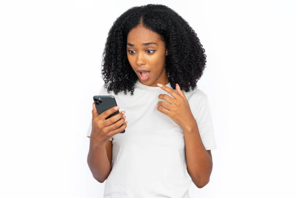istock Shocked African American woman using phone 1448705685