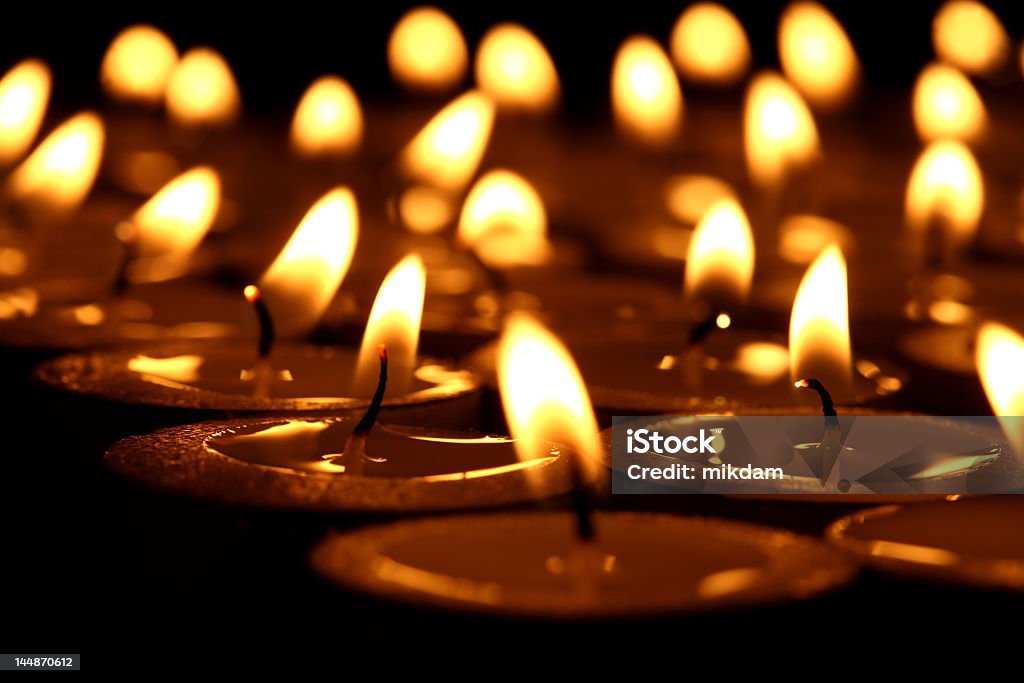 Lots of lit candles in the dark candles Backgrounds Stock Photo