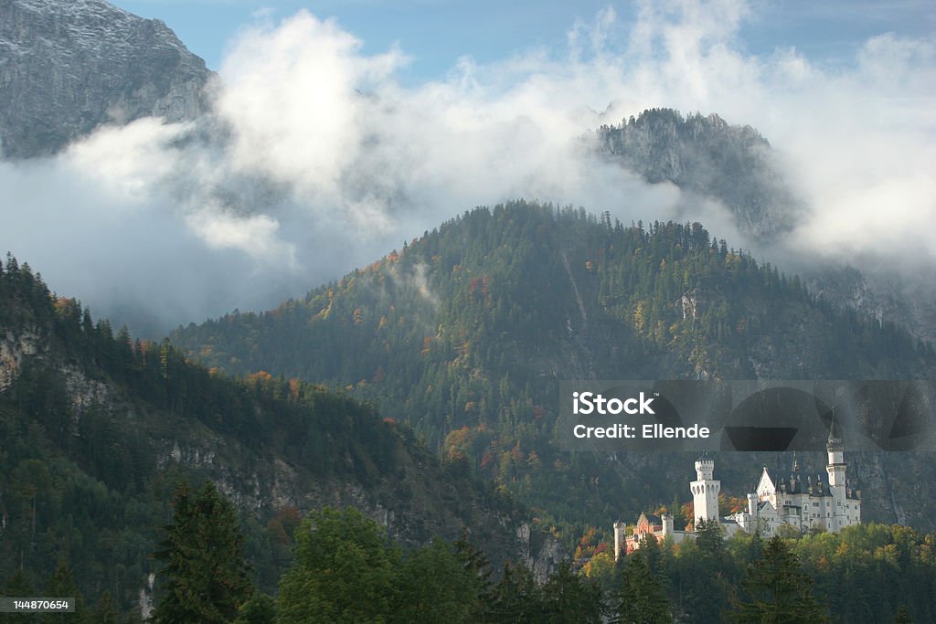 Mountain castle The Neuschwanstein castle in Bavaria, on a beautiful day in autumn. Neuschwanstein Castle Stock Photo