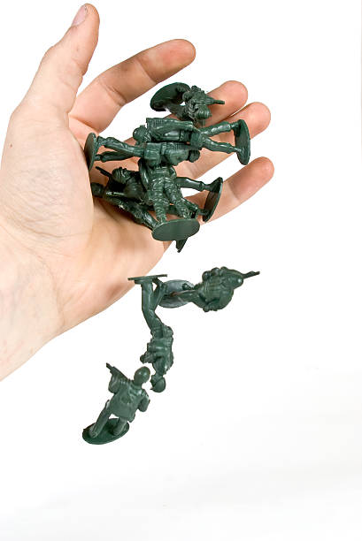 Toy soldier with human hand