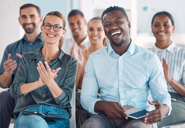 istock Workshop, applause and conference with audience in presentation for team building, training and award goals event. Feedback, success and coaching with crowd of business people in global seminar 1448708475