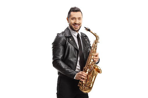 Guy with a saxophone smiling at the camera isolated on white background