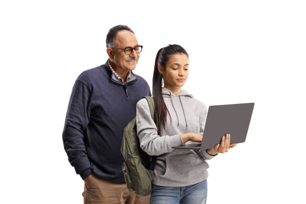 istock Mature man and a female student standing and using a laptop  computer 1448709816