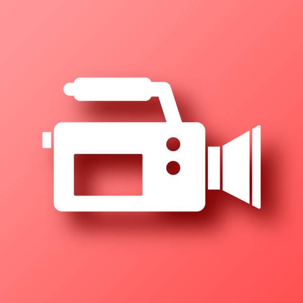 ビデオカメラ。赤い背景に影付きのアイコン - red background video点のイラスト素材／クリップアート素材／マンガ素材／アイコン素材