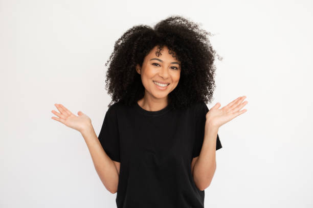 istock Cheerful young woman shrugging throwing up hands 1448711855