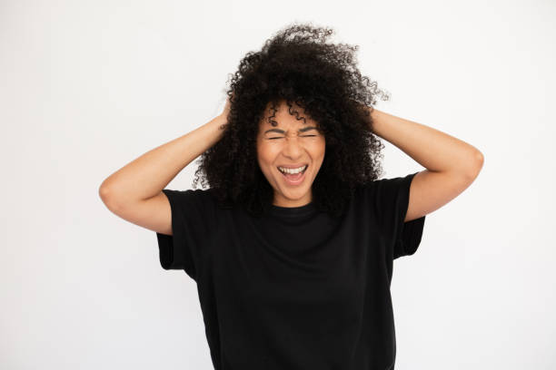istock Irritated young woman suffering from headache 1448711899
