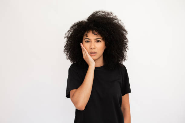 istock Surprised young woman holding her face with hand 1448711958