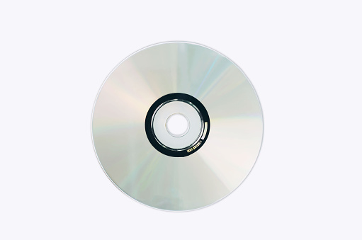 Realistic white cd template isolated on white background. represent technology from the 90s. Stacks of CDs, old songs and old movies.