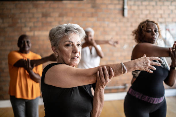 istock Senior women stretching in a exercise class 1448717491