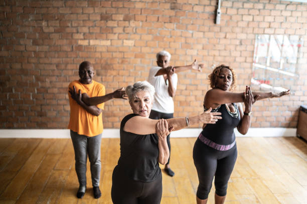 istock Senior women stretching in a exercise class 1448717506