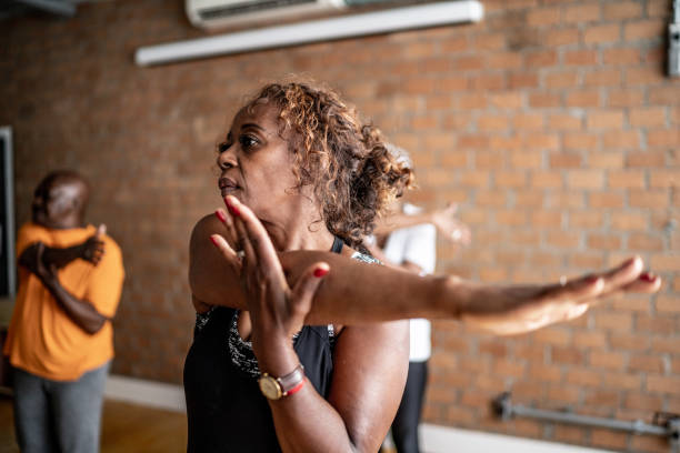 istock Senior women stretching in a exercise class 1448717545