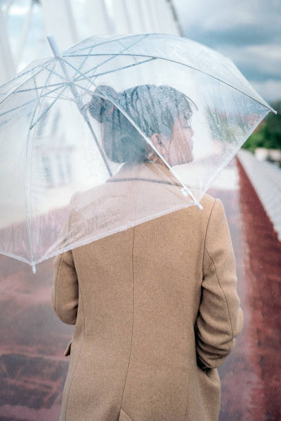 istock Walking in the City Under the Rain 1448718796