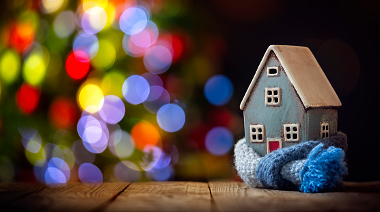 House and home winter heating and insulation background with christmas tree, fuel and energy crisis concept