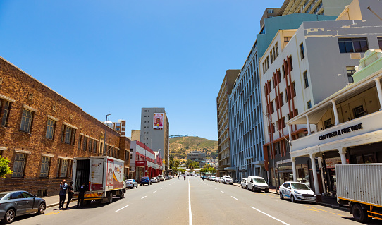 Cape Town, South Africa - December 7, 2022: Street view of city buildings with Table Mountain in background