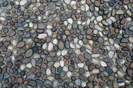 Pavement pebble pathway pattern texture background, the part of italian old style stone road