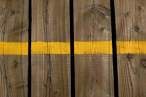 istock Yellow line on wooden planks 144872287