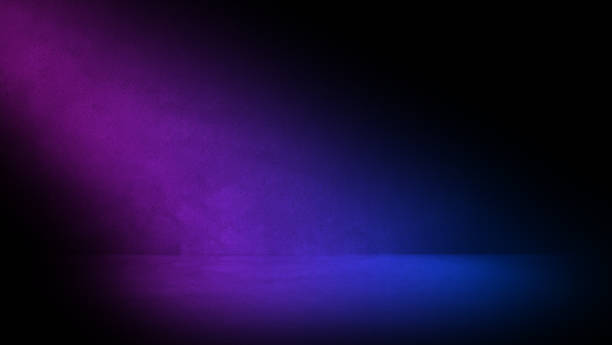 istock Dark concrete room with pink and blue light. Black three dimensional room background with colorful spotlight and shadow. Empty concrete floor and wall  with nobody and copy space for mock up. 1448734226