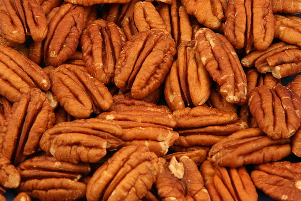 istock Closeup of whole, brown, pecan nuts 144873544