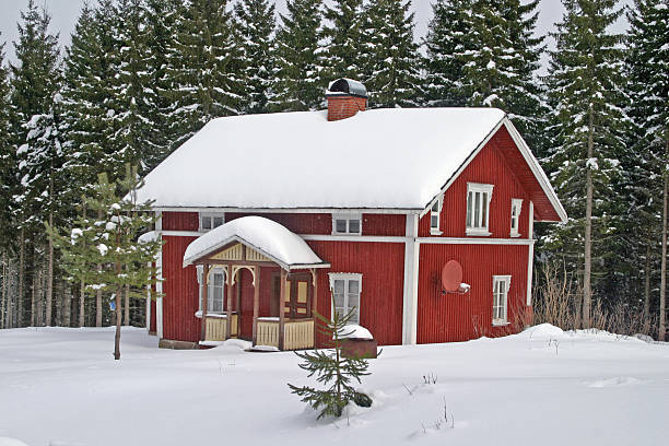 istock Red wooden house in winter time 144873596