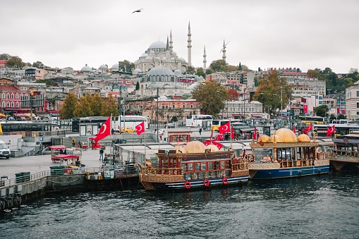 Istanbul, Turkey – October 10, 2021: View on boats uppon Bosphorus river in Istanbul